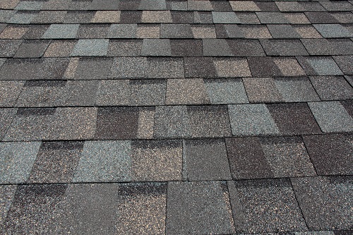 A newly installed composition asphalt shingle roof by a roofing contractor in Greenwich, CT.