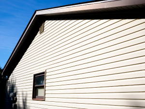 A photo of a home with beige siding and brown windows in Monroe, CT
