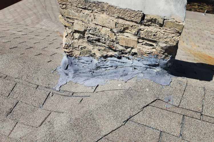 Damaged roof shingles in need of repairs in Darien.